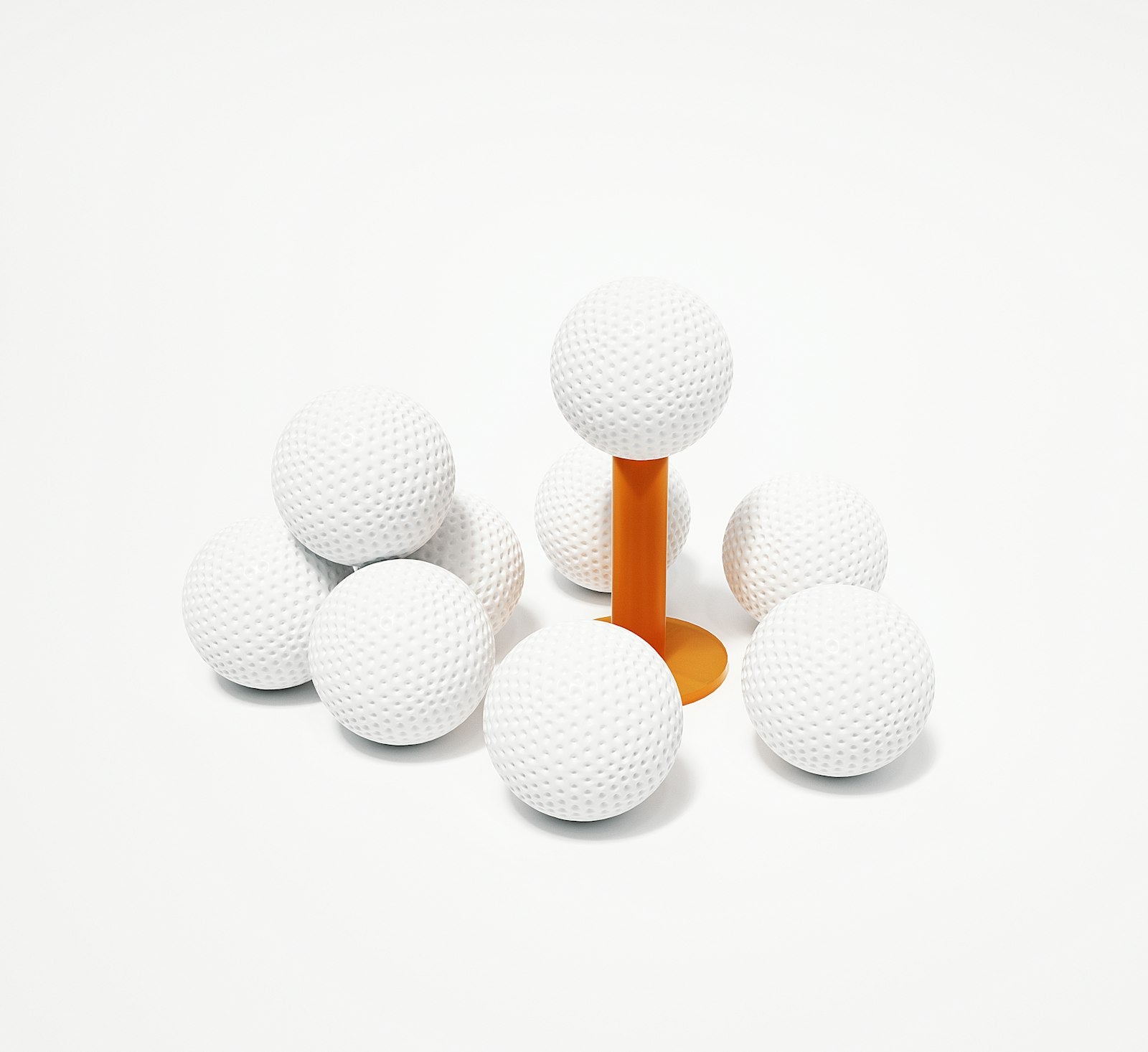 Image of Golf balls resting on an orange tee, close-up equipment shot